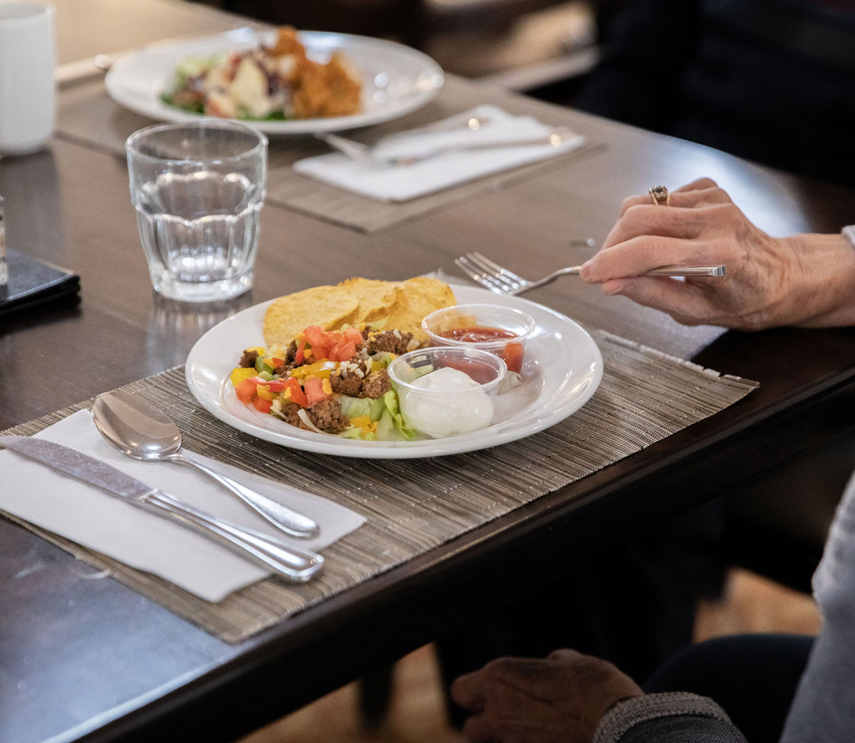 resident eating taco salad