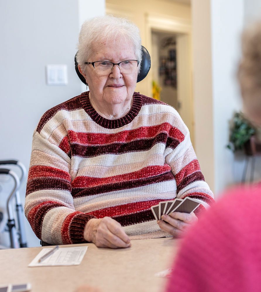 resident holding cards