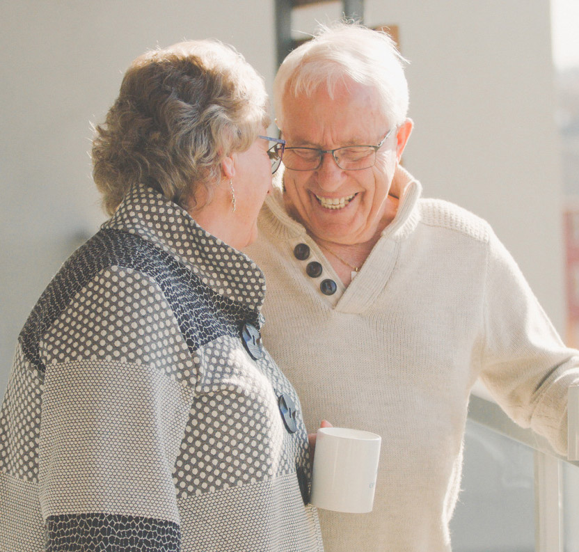 smiling residents with coffee