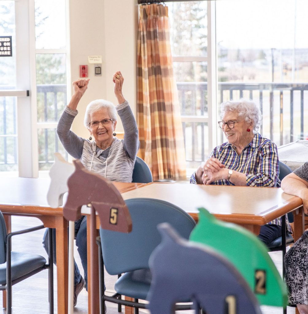 residents enjoying game in activity room
