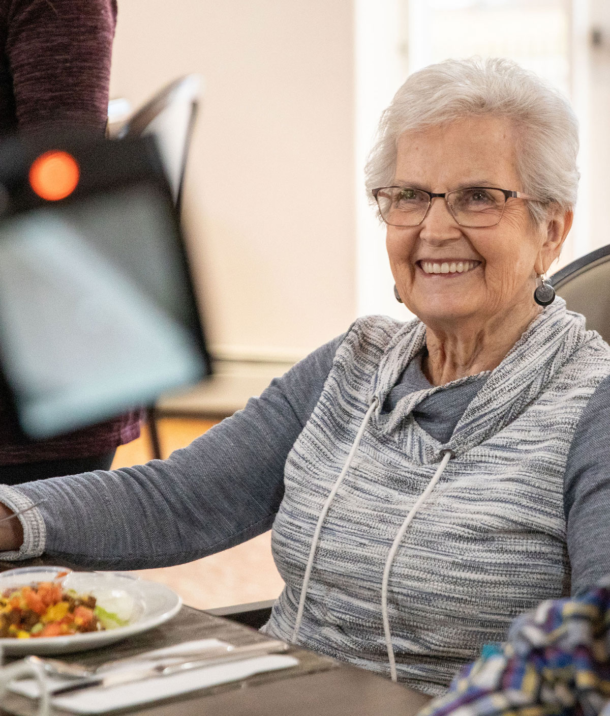 smiling resident at table 1